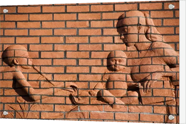 Brick relief of mother and children DP035286