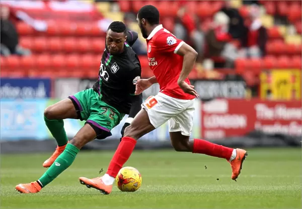 Bristol City's Kodjia Outmaneuvers Charlton's Bergdich in Sky Bet Championship Clash