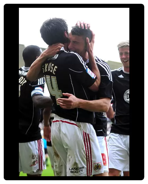 Bristol City: Cole Skuse and James Wilson Celebrate Second Goal Against Derby County in Championship Match, April 2011