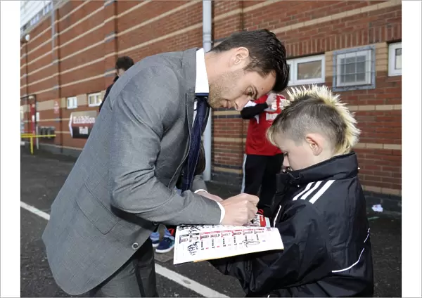 Bristol City's Sam Baldock Brings Smiles to a Young Fan with Autographed Programme