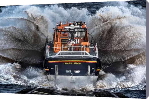 Cromer Tamar class lifeboat Lester 16-07 launching down the slipway, lots of white spray