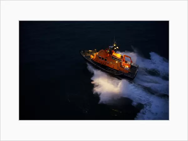 Aran Islands severn class lifeboat David Kirkaldy 17-06. Aerial shot taken from Irish Coastguard helicopter, lifeboat heading from right to left at night