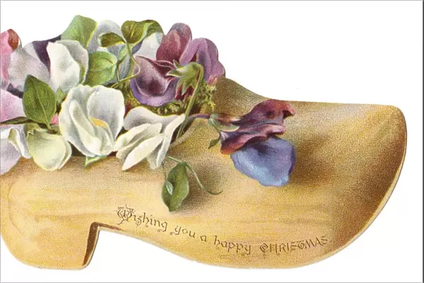 Flowers in a wooden clog-shaped Christmas card