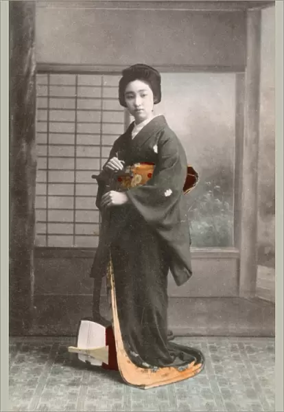 Japanese Geisha standing with her Traditional Shamisen