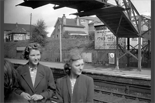 Two women at a railway station, South London
