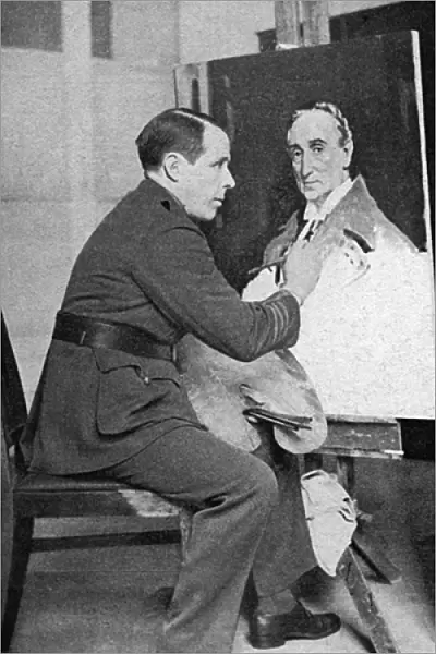 Sir William Orpen at work on a portrait