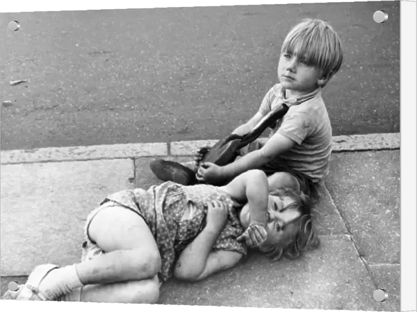 Two children on pavement, Balham, SW London