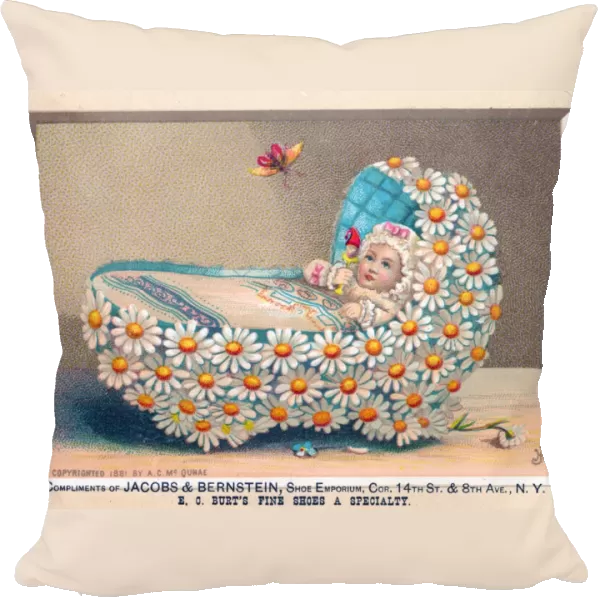 Baby in cradle made of flowers on a greetings card