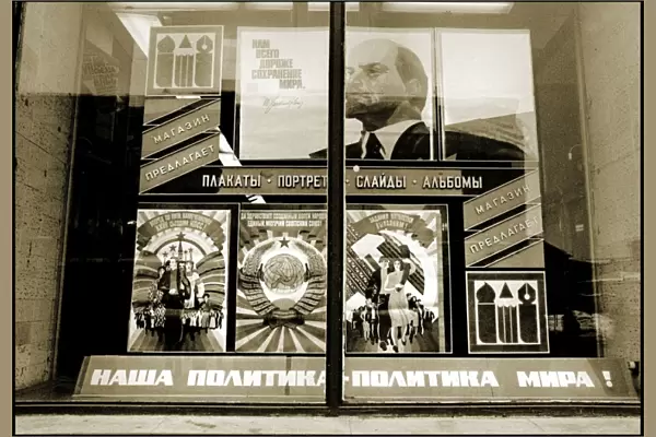 Soviet-era posters displayed in a window - Moscow