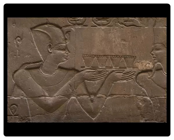 Relief depicting a pharaoh making offerings to the god MIN