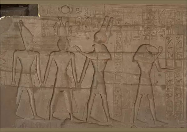 Relief depicting a Pharaoh Ramses II with different gods. Ra