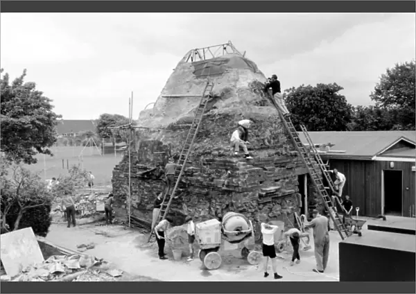 Boys build mountain at school, Seaford, East Sussex