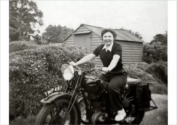 Woman on a 1938 Ariel motorcycle