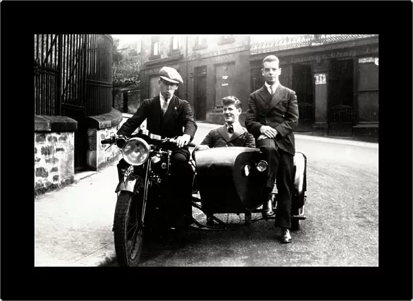 Three young men on veteran BSA motorcycle