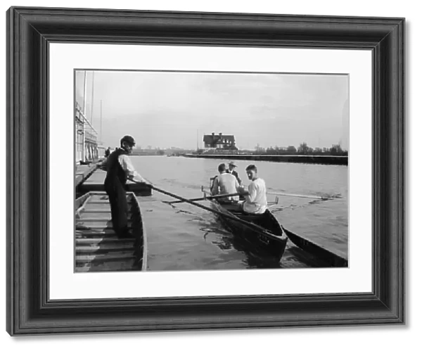 Rowers in a scull on a river