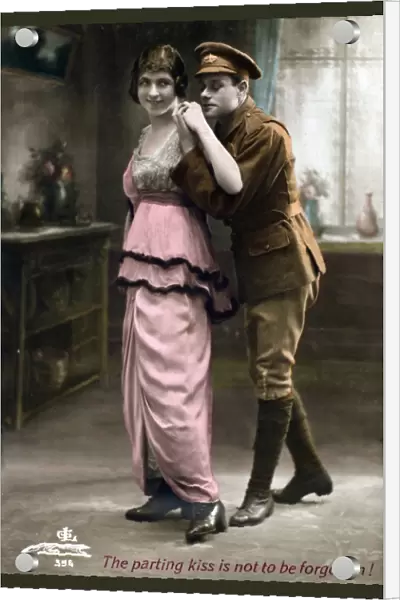 Soldier standing behind a young lady - Postcard