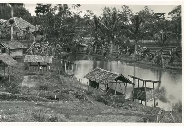 Java, Indonesia - Small shelters on the riverbank