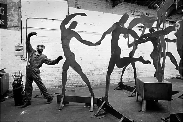 Dancing welder with sculpture