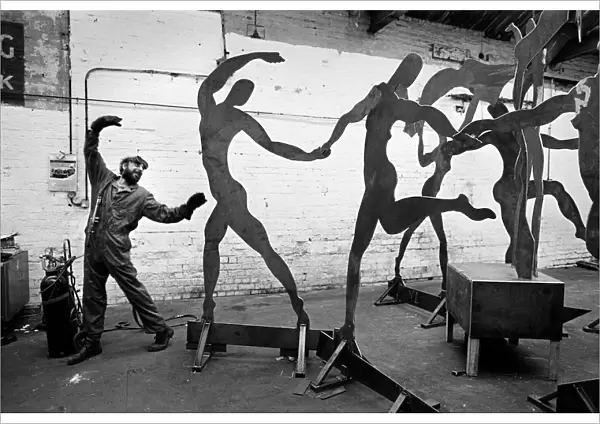 Dancing welder with sculpture