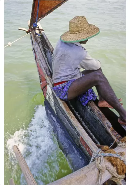 Sri Lankan fisherman in outrigger boat - 2