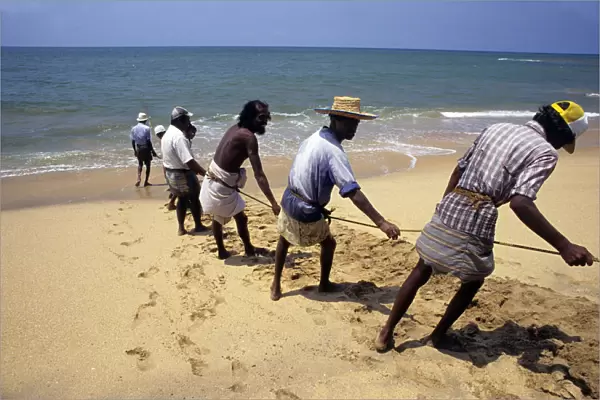 Sri Lankan beach fishermen hauling nets - 3