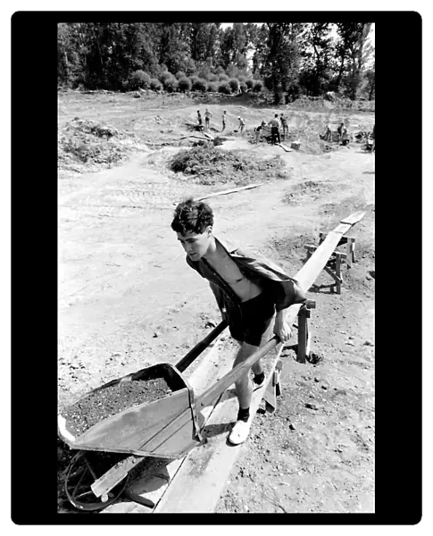 Boy with a wheelbarrow, taking part in a Communist Youth labour camp in former Yugoslavia