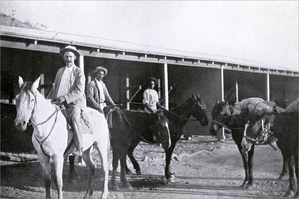 Mounted police constable and aborigine trackers on patrol