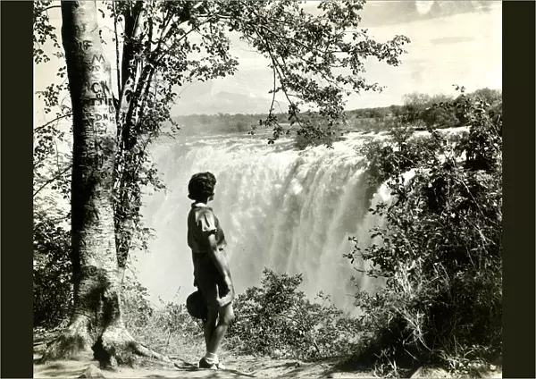 Girl standing by Victoria Falls, southern Africa