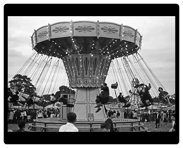 Fairground carousel with riders