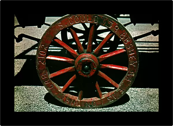 Wooden spoked wheel on market barrow, London