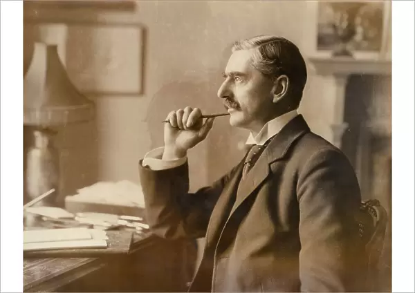 Neville Chamberlain, British politician, at his desk