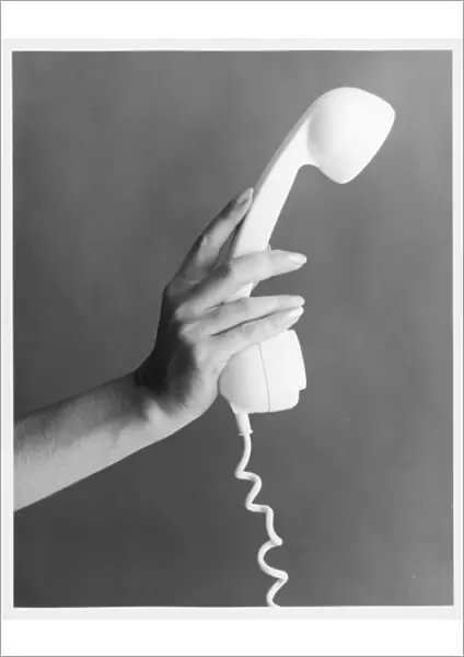 Hand Holds a Telephone