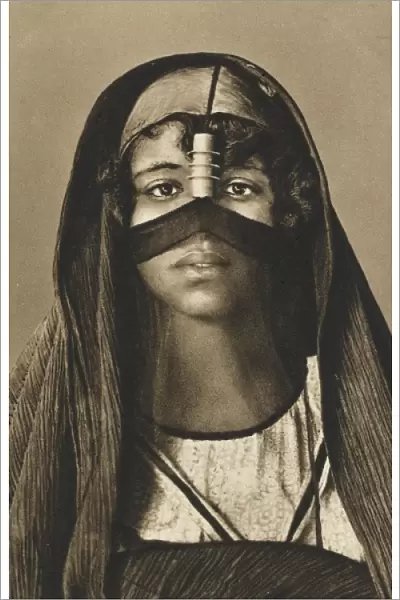 A young Egyptian woman in traditional headdress
