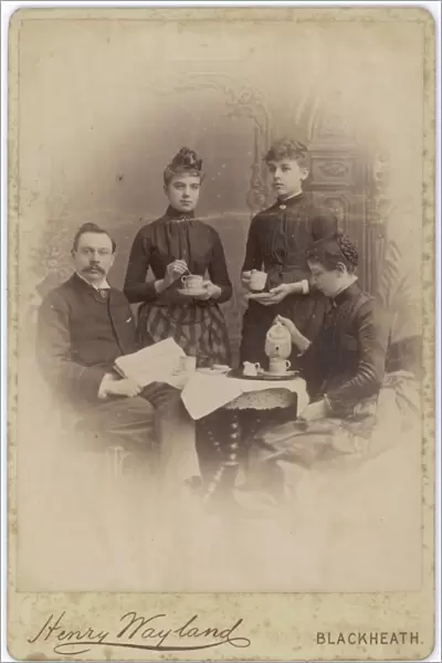 Edwardian family at the coffee table