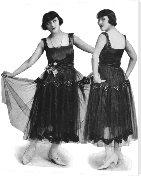 The Dolly Sisters modelling smart evening gowns