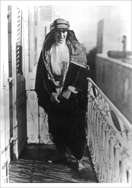 T E Lawrence (Lawrence of Arabia) on a balcony