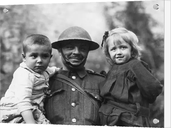 Soldier with two refugee children, Tournai, Flanders, WW1