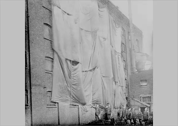 London Salvage Corps sheeting a warehouse wall
