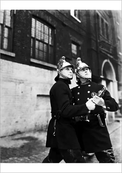 LCC-LFB Two firemen at hose drill, Southwark SE1