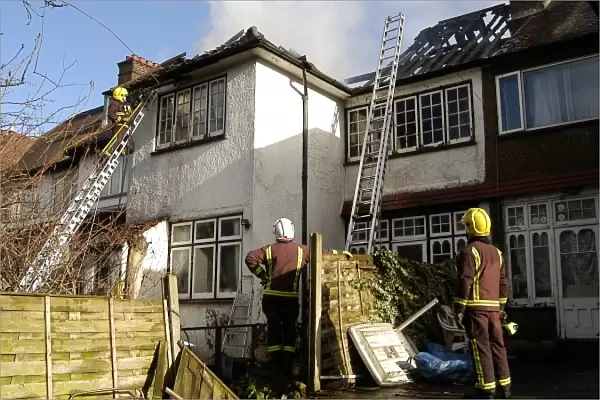 Firefighters dealing with a house fire