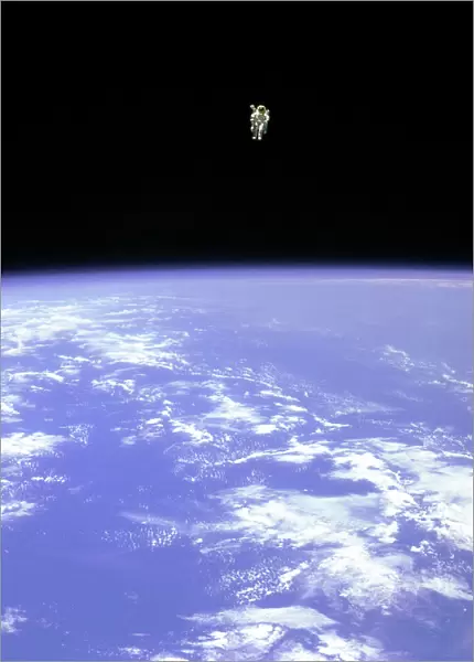 EVAtion. Mission Specialist Bruce McCandless II, is seen further away