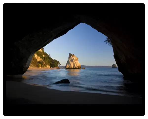 Cathedral Cove by erosion artfully sculpted rock formation seen through a natural rock arch at Cathedral Cove Cathedral Cove, Coromandel Peninsula, North Island, New Zealand