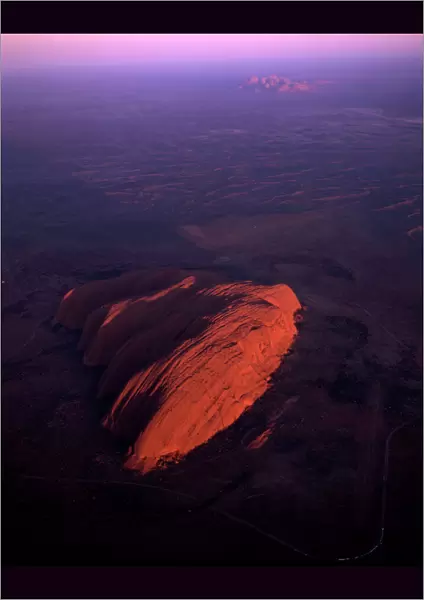 Uluru (Ayers Rock) at sunrise, aerial image, Uluru-Kata Tjuta National Park (World Heritage Area), Northern Territory, Australia JPF44469
