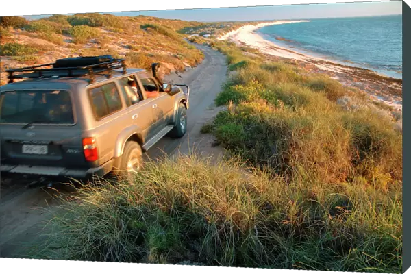 Western Australia - well-equipped 4WD vehicle driving over rough track towards the beach at Warroora Station, Ningaloo Reef Marine Park, Western Australia. No PR LSP00141
