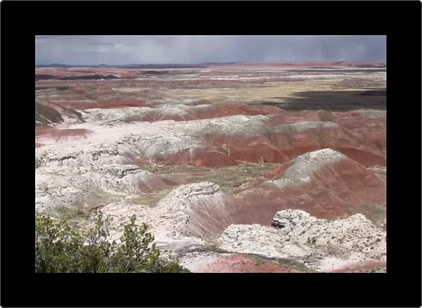 View over Painted Desert, the white layers are sandstone, the reds are either iron stained siltstone or rocks stained by iron oxide. Arizona, USA