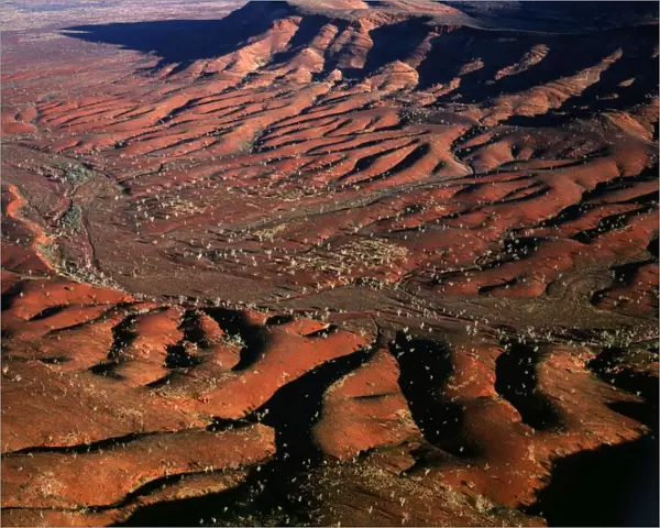 Aerial: south-western side of Hamersley Range - the Pilbara seabed rose to form one of Earth's first permanent land masses about 3. 5 billion years ago. The area shown is rich in iron oxides Pilbara region, Western Australia JPF44349