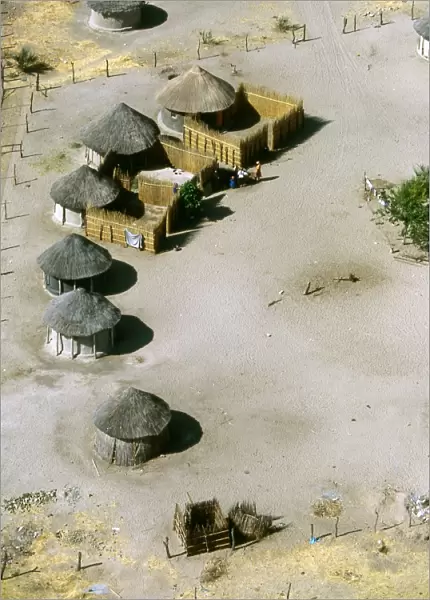 Aerial view of thatched rondavels made of mud and straw in a typical African village. Maun, Botswana