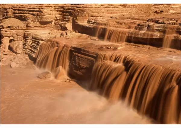 Grand Falls - raging muddy falls of the Little Colorado River during snowmelt. This spectacle occurs only a few days during the year, either during spring snowmelt or after a period of intense monsoon rainstorms