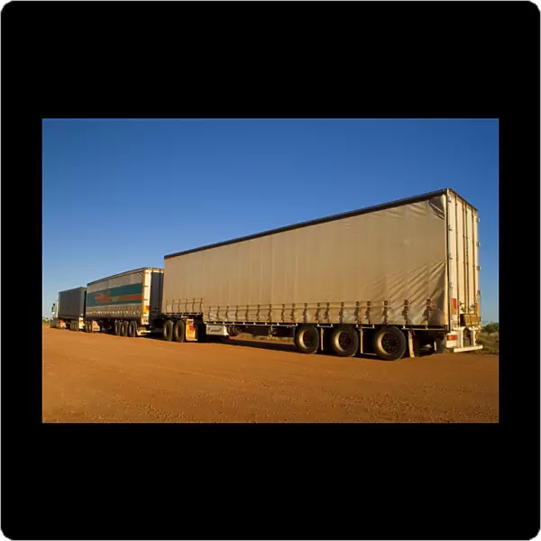 Roadtrain - a huge roadtrain with 3 trailers is a common sight in the outback of the Northern Territory and Western Australia. They can be up to 54 m long - Western Australia, Australia