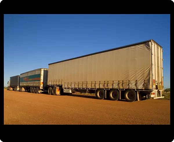 Roadtrain - a huge roadtrain with 3 trailers is a common sight in the outback of the Northern Territory and Western Australia. They can be up to 54 m long - Western Australia, Australia